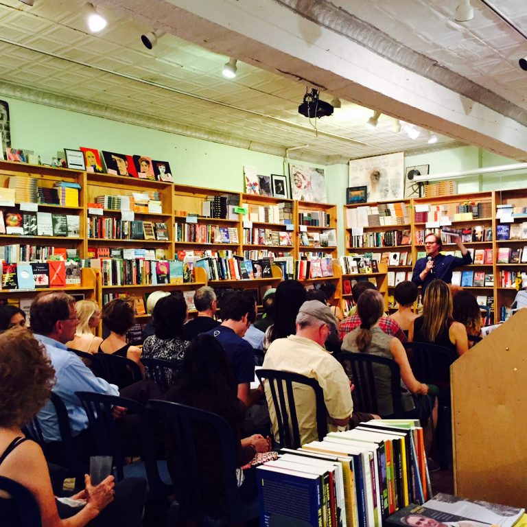 Bill speaking at a bookstore